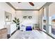 Bright Bedroom featuring a white crib, patterned wallpaper, hardwood floors, and natural light at 661 Auburn Ne Ave # 10, Atlanta, GA 30312