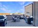 Outdoor deck with grill, comfortable seating, and a cozy fireplace for relaxing evenings at 661 Auburn Ne Ave # 10, Atlanta, GA 30312