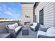Beautiful deck featuring a modern fireplace, comfortable seating, and a view of the neighborhood at 661 Auburn Ne Ave # 10, Atlanta, GA 30312