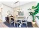 A dining room showcases a rustic table, chandelier, and decorative wallpaper at 661 Auburn Ne Ave # 10, Atlanta, GA 30312