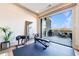Exercise room with a view to the outdoor deck featuring a grill and comfortable seating at 661 Auburn Ne Ave # 10, Atlanta, GA 30312