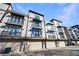 Modern townhome row with individual garages and private balconies at 661 Auburn Ne Ave # 10, Atlanta, GA 30312