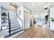 Welcoming foyer with an open staircase, hardwood floors, and views into the kitchen at 661 Auburn Ne Ave # 10, Atlanta, GA 30312