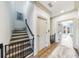 Hallway featuring hardwood floors, a staircase, and access to a bedroom with a balcony at 661 Auburn Ne Ave # 10, Atlanta, GA 30312
