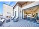 Inviting covered patio with fireplace and comfortable seating, seamlessly connected to the home's interior at 661 Auburn Ne Ave # 10, Atlanta, GA 30312
