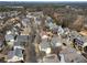 An overhead view showing multiple homes in a suburban neighborhood with established landscaping at 1637 Duncan Nw Dr, Atlanta, GA 30318