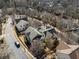 An aerial view showcasing various home styles and mature trees lining the streets at 1637 Duncan Nw Dr, Atlanta, GA 30318