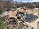 Aerial view of the community park featuring a pond, water features, and maintenance work at 1637 Duncan Nw Dr, Atlanta, GA 30318