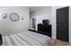 Cozy bedroom featuring a patterned bedspread, black dresser and accents at 1637 Duncan Nw Dr, Atlanta, GA 30318