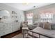 Bedroom featuring wood floors, neutral paint, white furniture with gold knobs and pink accents and details at 1637 Duncan Nw Dr, Atlanta, GA 30318