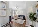 Bedroom with a navy crib, a glider, a ceiling fan, hardwood floors, and light grey walls at 1637 Duncan Nw Dr, Atlanta, GA 30318