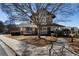 View of the attractive community clubhouse with covered porch and mature landscaping at 1637 Duncan Nw Dr, Atlanta, GA 30318