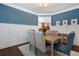 Bright dining room boasts a wooden table, upholstered chairs, and ample natural light at 1637 Duncan Nw Dr, Atlanta, GA 30318