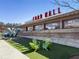 Outdoor seating next to the Food Hall, surrounded by attractive artificial turf and green chairs at 1637 Duncan Nw Dr, Atlanta, GA 30318