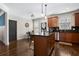 Spacious kitchen showcases dark hardwood floors and a center island with seating at 1637 Duncan Nw Dr, Atlanta, GA 30318