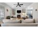 Cozy living room featuring a fireplace with built-in shelves and cabinets, perfect for entertaining at 1637 Duncan Nw Dr, Atlanta, GA 30318