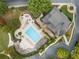 Aerial view of community pool and clubhouse with ample seating and beautiful landscaping at 1637 Duncan Nw Dr, Atlanta, GA 30318