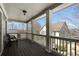 Covered porch with stained wood floors, white pillars and banisters, and outdoor seating, offering a pleasant outdoor space at 1637 Duncan Nw Dr, Atlanta, GA 30318