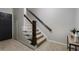 Carpeted staircase with wooden railing leading to upper level of the house at 1637 Duncan Nw Dr, Atlanta, GA 30318