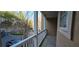 Balcony with white railings overlooking the street and the surrounding nature at 222 Ashford Cir # 222, Atlanta, GA 30338