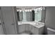 Bathroom with a double sink vanity, decorative lighting, and a mirror at 222 Ashford Cir # 222, Atlanta, GA 30338