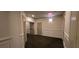 Carpeted condo hallway with unit doors and classic paneled walls at 222 Ashford Cir # 222, Atlanta, GA 30338