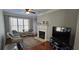 Cozy living room with wicker seating, a fireplace, and large windows for natural light at 222 Ashford Cir # 222, Atlanta, GA 30338