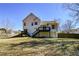 Expansive backyard featuring the home's back exterior and a wooden fence at 2971 Ruby Ct, Powder Springs, GA 30127