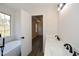 Stylish bathroom with double sinks, modern lighting, and a soaking tub next to a serene window view at 2971 Ruby Ct, Powder Springs, GA 30127