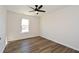 Bedroom features luxury vinyl flooring, ceiling fan, and a window at 2971 Ruby Ct, Powder Springs, GA 30127