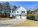 Charming two-story home featuring a two-car garage and a well-manicured lawn at 2971 Ruby Ct, Powder Springs, GA 30127