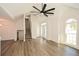 Bright living room with stairs, a large window, wood-look floors, and ample space for entertaining at 2971 Ruby Ct, Powder Springs, GA 30127