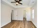 Bright main bedroom with tray ceiling, ceiling fan, and wood-look flooring at 2971 Ruby Ct, Powder Springs, GA 30127