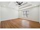 Spacious bedroom featuring a tray ceiling, recessed lighting, and a large window at 3182 Glynn Mill Dr, Snellville, GA 30039