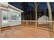 Outdoor deck overlooking private backyard and a beautiful sunroom addition at 3182 Glynn Mill Dr, Snellville, GA 30039