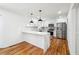 Modern kitchen with white cabinetry, stainless steel appliances, and beautiful countertops at 3182 Glynn Mill Dr, Snellville, GA 30039