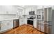 Stylish kitchen featuring white cabinets, stainless steel appliances, and elegant countertops at 3182 Glynn Mill Dr, Snellville, GA 30039