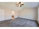 Spacious bedroom with neutral colors, large window, ceiling fan, and ensuite bathroom at 9185 Brockham Way, Alpharetta, GA 30022