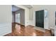 Inviting foyer featuring hardwood floors, wainscoting, and a view into the next room at 9185 Brockham Way, Alpharetta, GA 30022