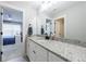 Bright bathroom with granite countertop, modern fixtures, and decorative mirror at 17 Baral Rdg, Sharpsburg, GA 30277