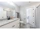 Well-lit bathroom with granite countertops, modern fixtures, and easy access to the bedroom at 17 Baral Rdg, Sharpsburg, GA 30277