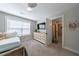 Comfortable bedroom featuring plush carpet, large window, and easy access to the bathroom at 17 Baral Rdg, Sharpsburg, GA 30277