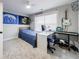 Well-lit bedroom with comfortable bed, desk, and musical instruments at 17 Baral Rdg, Sharpsburg, GA 30277