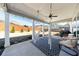 Relaxing covered patio featuring hanging hammock chairs, ceiling fan and outdoor furniture at 17 Baral Rdg, Sharpsburg, GA 30277