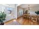 Bright dining room with hardwood floors, modern chandelier and view of the front lawn at 17 Baral Rdg, Sharpsburg, GA 30277