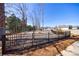 A fenced dog park area with mature trees offering a safe and enjoyable space for pets at 17 Baral Rdg, Sharpsburg, GA 30277