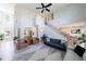 Bright living room featuring high ceilings, hardwood floors, and ample natural light at 17 Baral Rdg, Sharpsburg, GA 30277