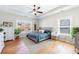 Serene bedroom with tray ceilings, ceiling fan, and natural light from multiple windows at 17 Baral Rdg, Sharpsburg, GA 30277