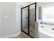 Modern bathroom with glass-enclosed shower and separate soaking tub at 17 Baral Rdg, Sharpsburg, GA 30277