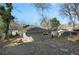 Large backyard featuring a detached garage and mature trees, perfect for outdoor activities and relaxation at 2006 Conrad Se Ave, Atlanta, GA 30315